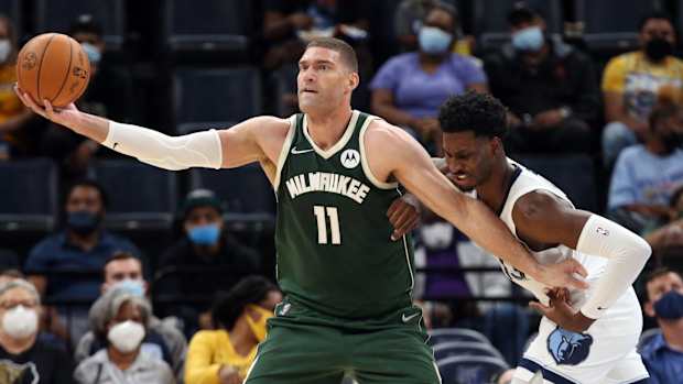 Milwaukee Bucks center Brook Lopez (11) fights for position against Memphis Grizzles forward Jaren Jackson Jr. (13)